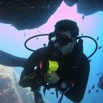 Scuba Diving underwater in Gran Canaria - Divemaster with torch
