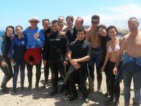 A group of divers enjoy the sunshine before going for a dive in the El Cabrón Marine Reserve